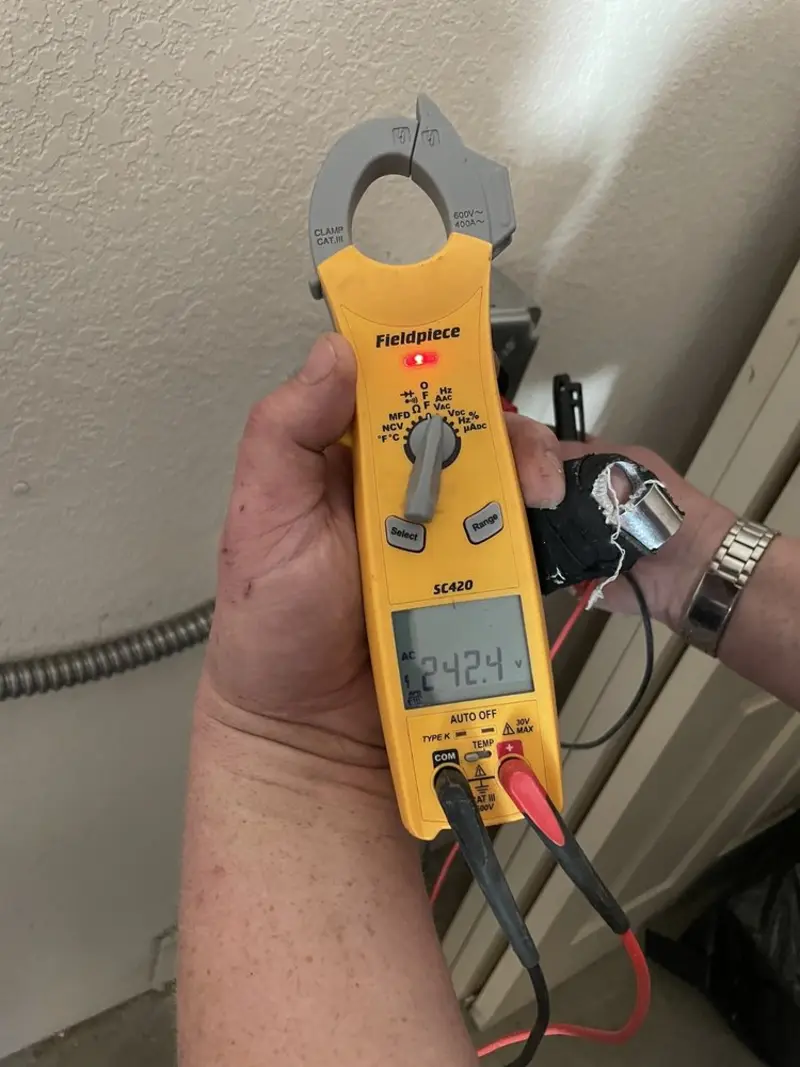 Voltage testing with clamp meter during Recessed Lighting Installation in Deephaven